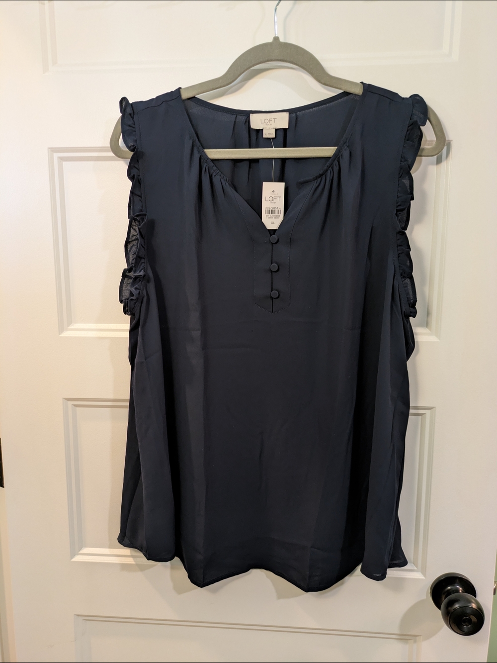 New with tags! LOFT Ruffle Sleeve Navy Sleeveless Blouse